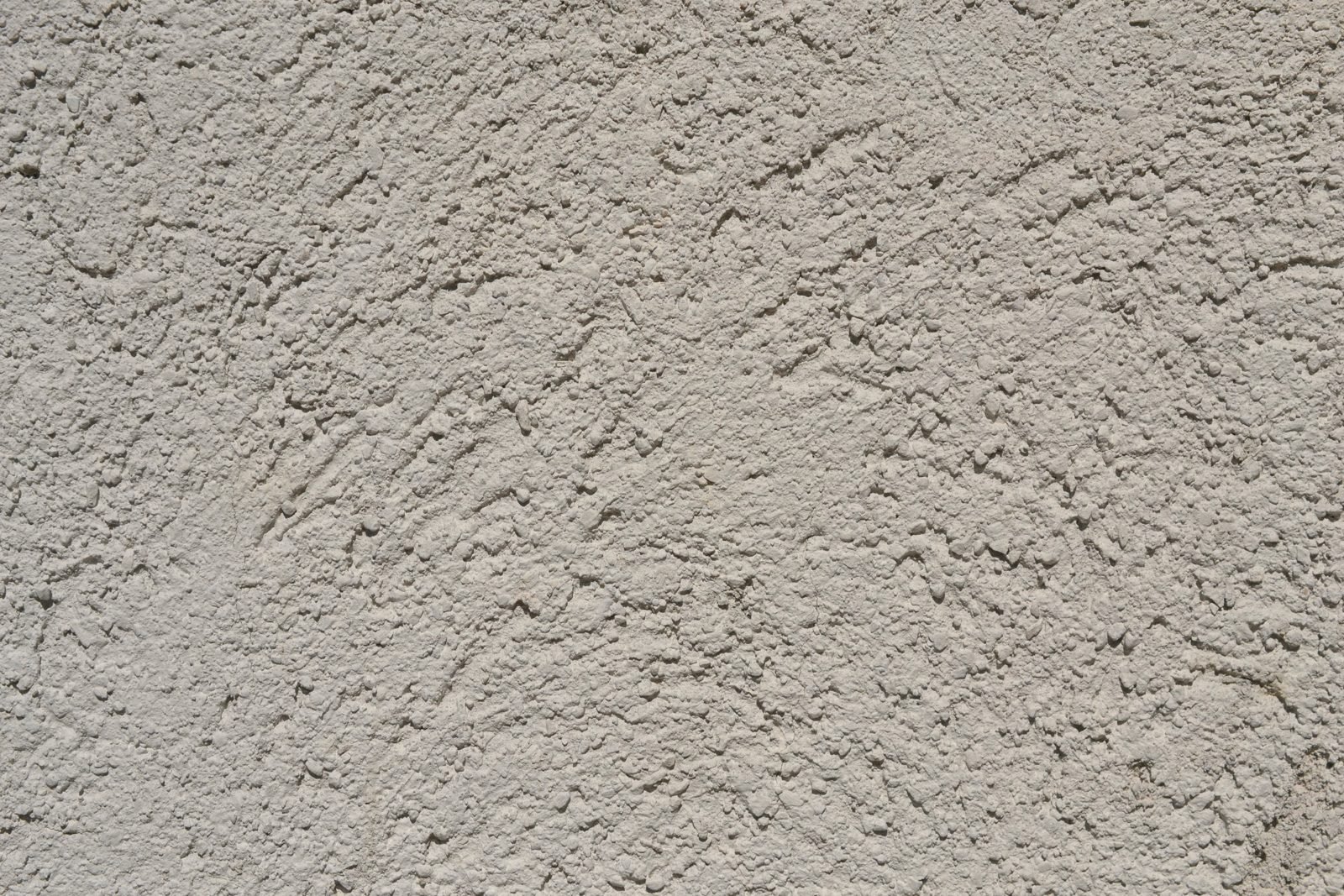 A hand-finished plaster surface in warm off-white.